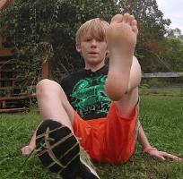 Irish boy shoes off goes barefoot