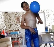 Blue jeans boy with a blue baloon