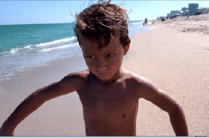 Strong kid at the beach